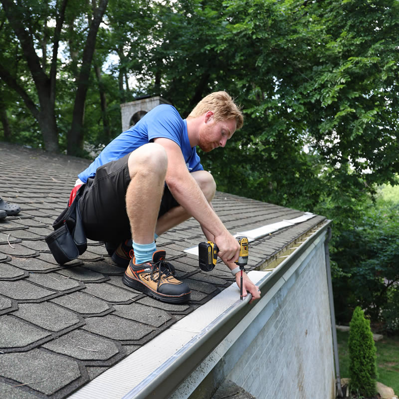 Marshall, owner of DIB Exterior-Washing, installing gutter guards in Springfield MO